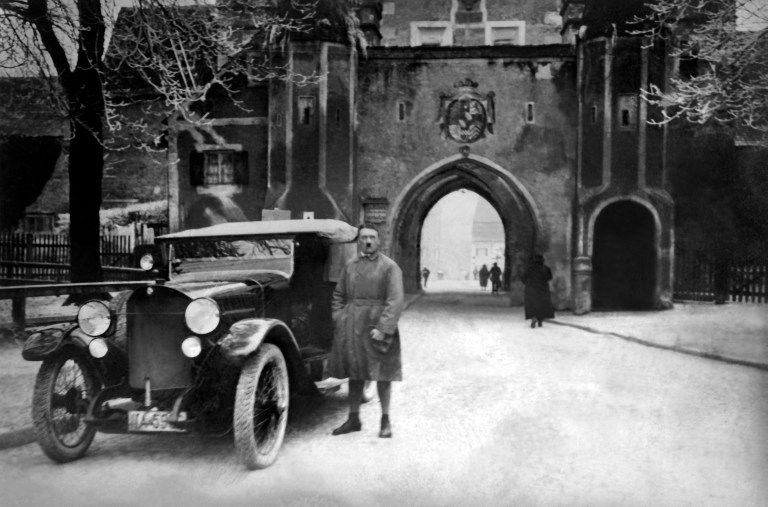 Adolf Hitler in front of the Bayertor gate across the Lech river after his release from Landsberg fortress prison. He spent only 9 months behind the bars (his initial sentence was 5 years)